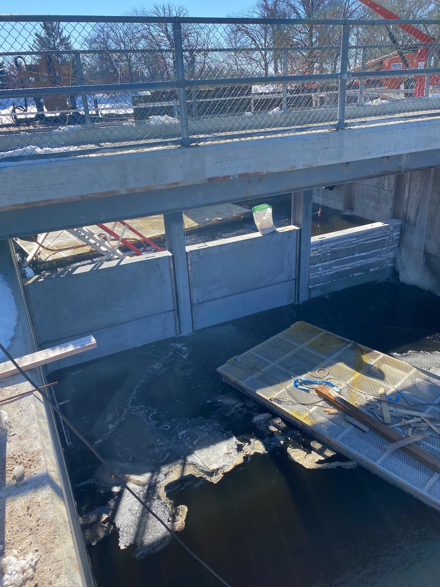 A construction site at a dam over a body of water
