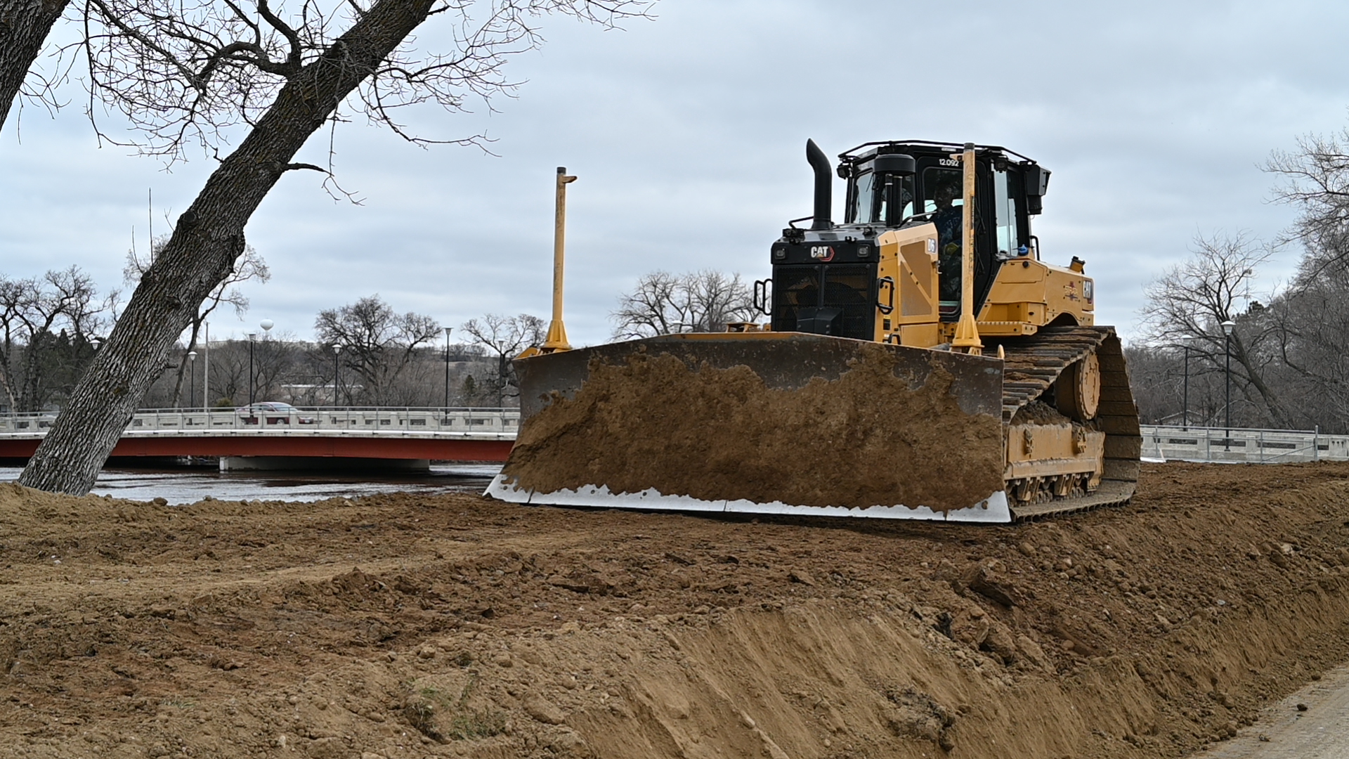  a bulldozer plows some dirt