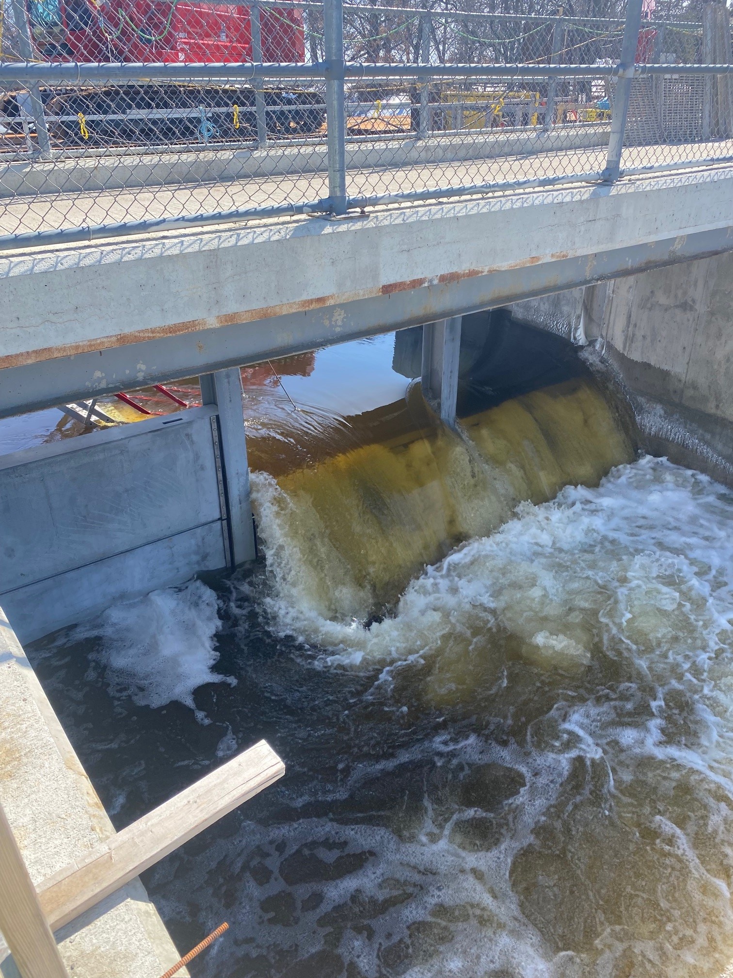 A construction site at a dam over a body of water
