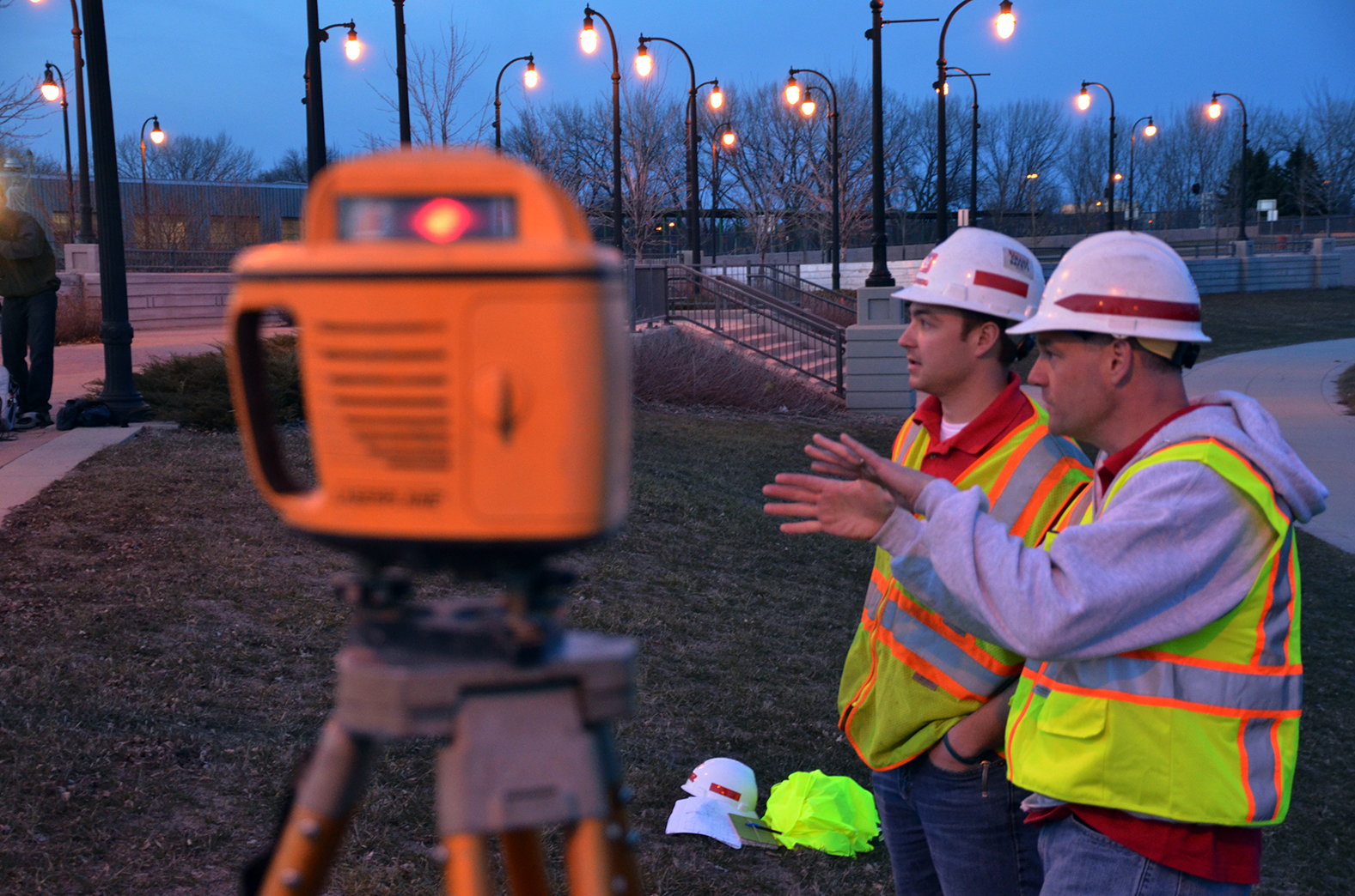 Jason Hager, left, and Paul Machajewski, both Corps of Engineers, St. Paul District employees, discuss building a temporary levee along 2nd Street in Fargo to help protect the city from flooding due to the rising Red River of the North April 26. This is the fourth time in the past five years that the Corps has supported the city’s flood fight. USACE photo by Patrick Moes