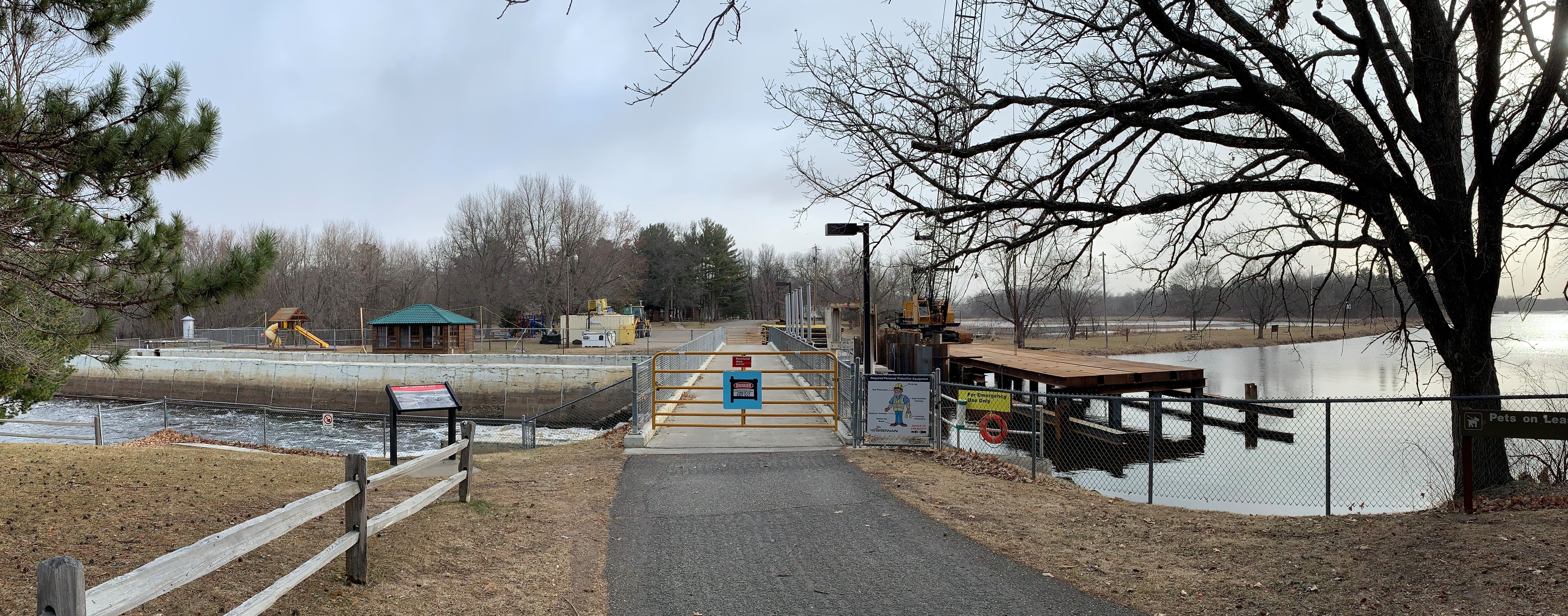 A view of a dam with construction equipment